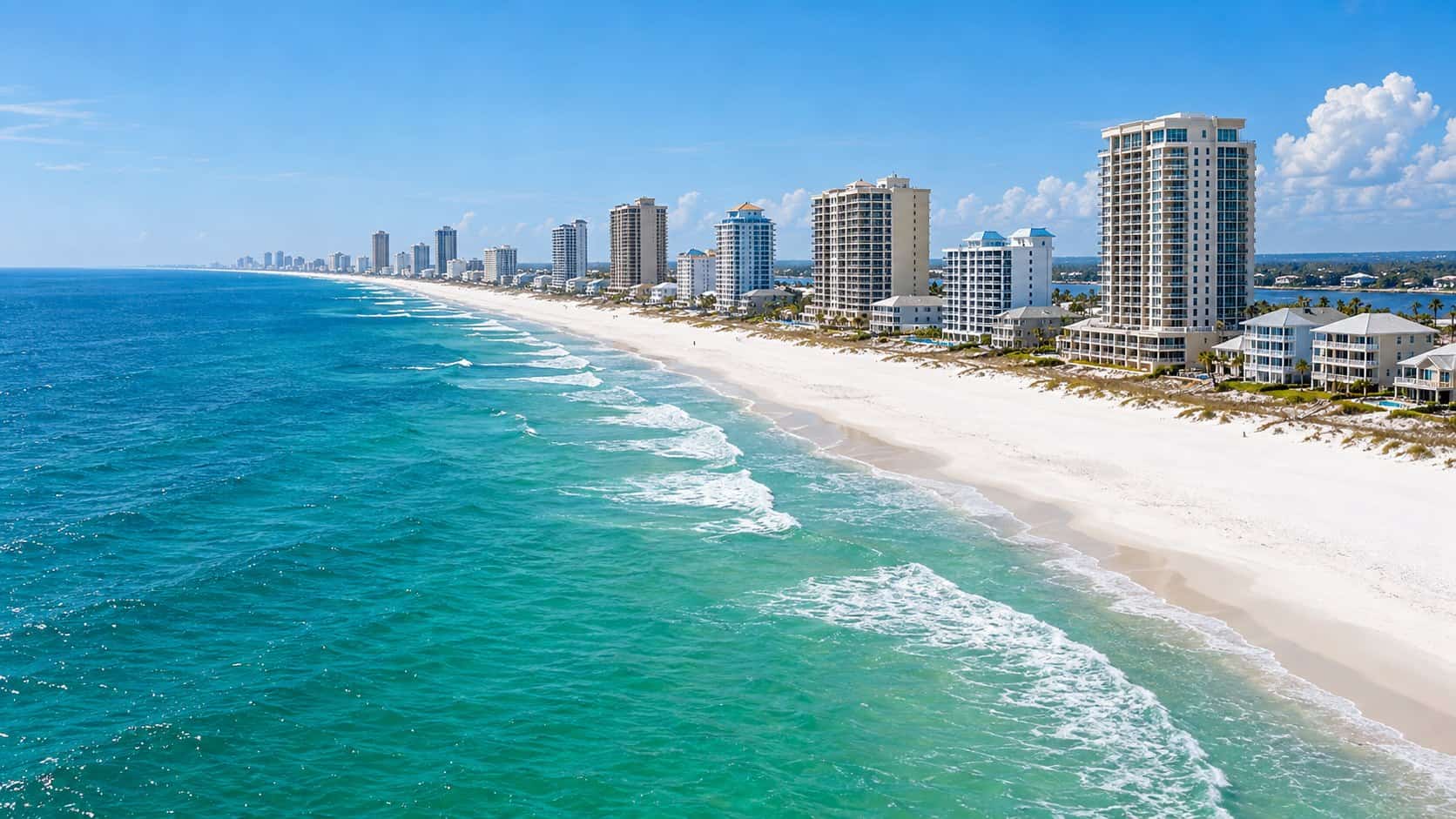 White sand beach and coastal skyline in Gulf Shores, Alabama